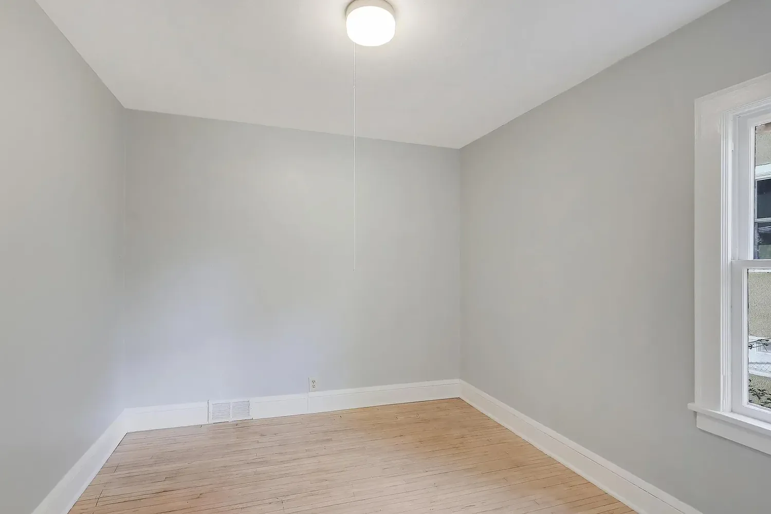 Freshly painted bedroom in warm grey with white trim, St. Louis Park
